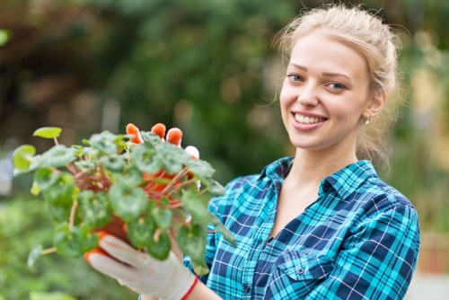 Gardener inspecting a landscaped garden